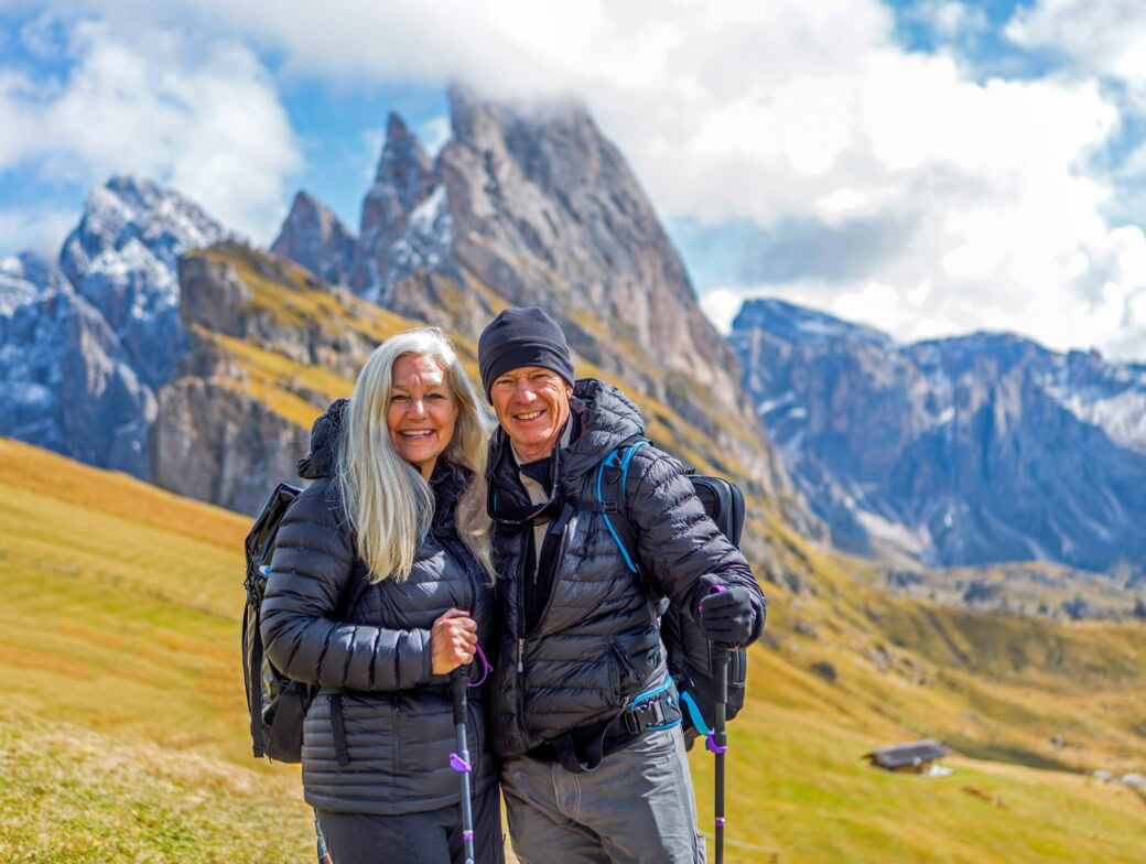 A couple hiking in the Alps.