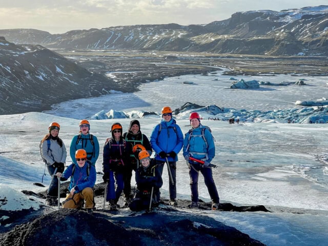 Guided group of hikers on the Sólheimajökull glacier, an outlet of the larger Mýrdalsjökull ice cap, located on the south coast of Iceland.