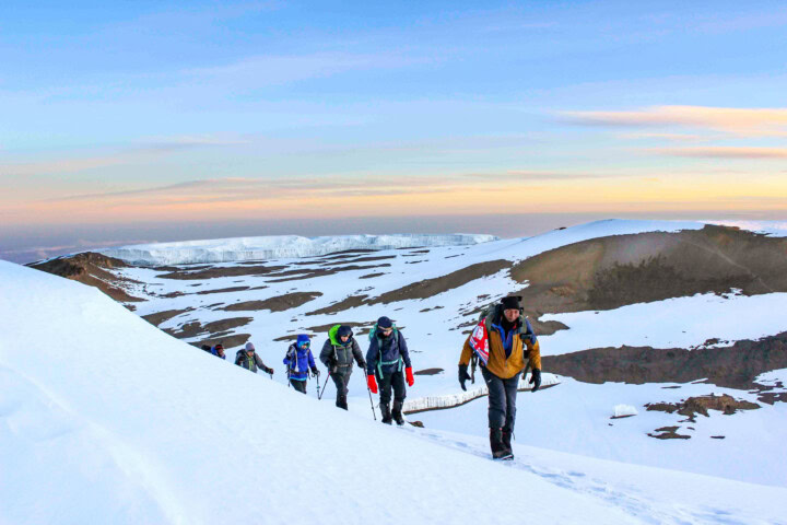 A group of people hiking mt. Kilimanjaro.