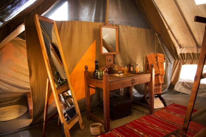 A bathroom sink and full length mirror.